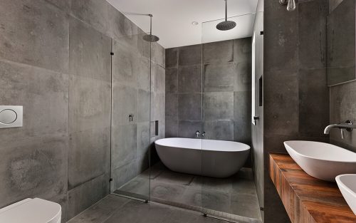Gray bathroom with natural wood accent