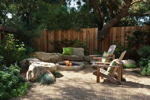 Stone Fire Pit With Adirondack Chairs