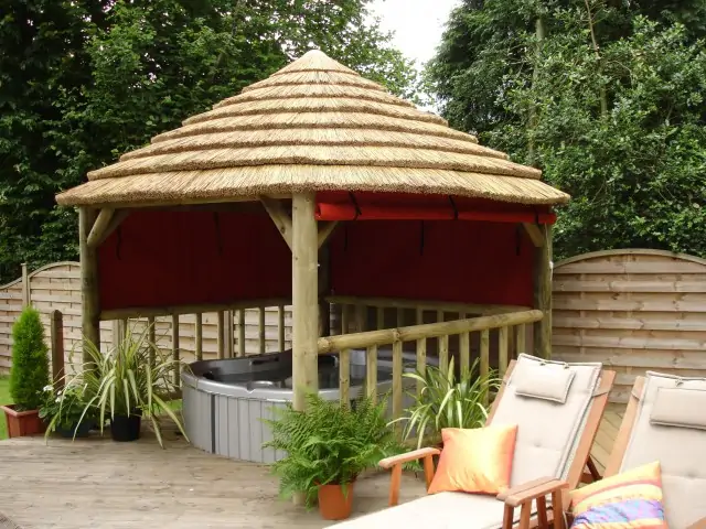 Hot tub enclosure with thatched roof
