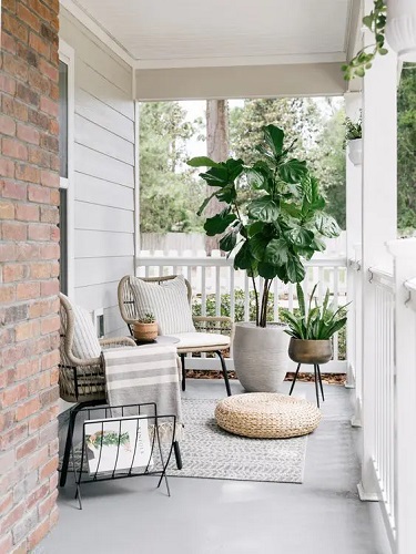 Stylish modern front porch with rattan chair