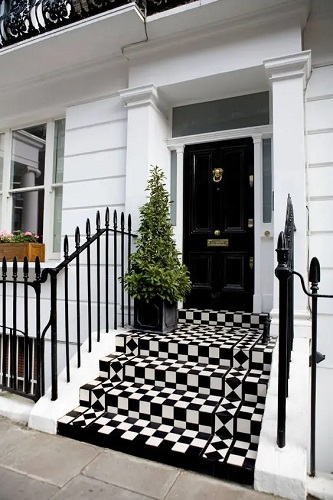 Tiny modern front porch with dark stained floor