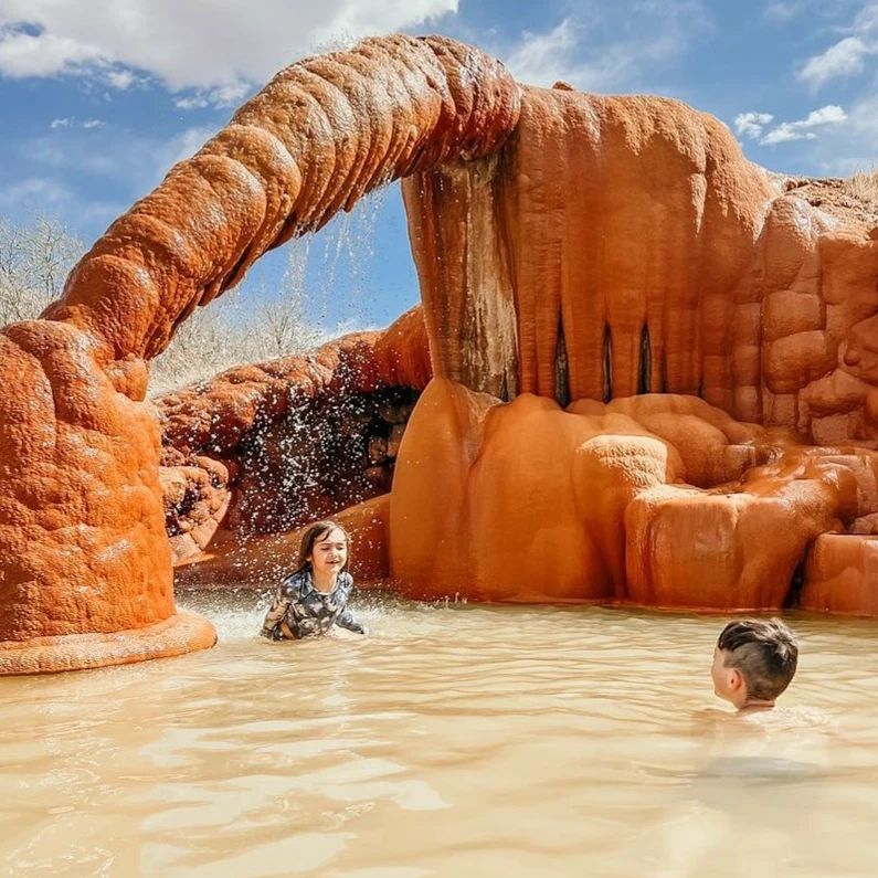 Two Kids play at Mystic Hot Springs Utah